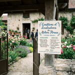 Sign reading “Conditions et Localisations des Ateliers Floraux,” with locations, conditions, and contact details.